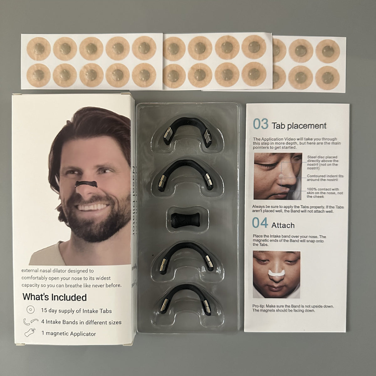 Kit contents with black magnetic bands in 4 sizes and sheets of adhesive tabs